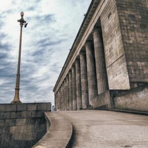 Grand facade of the University of Buenos Aires Faculty of Law on a cloudy day.